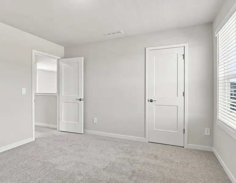 Spacious, unfurnished interior of a new home in Country Lane - Classic Series, Clayton (Image 17).