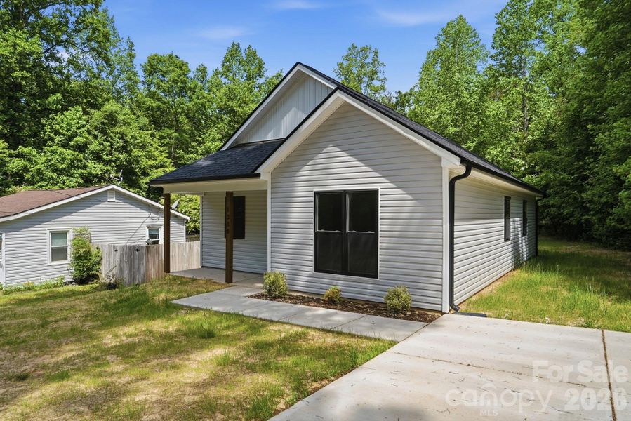 Front exterior of a new home in , Statesville, NC, highlighting curb appeal (Image 23).