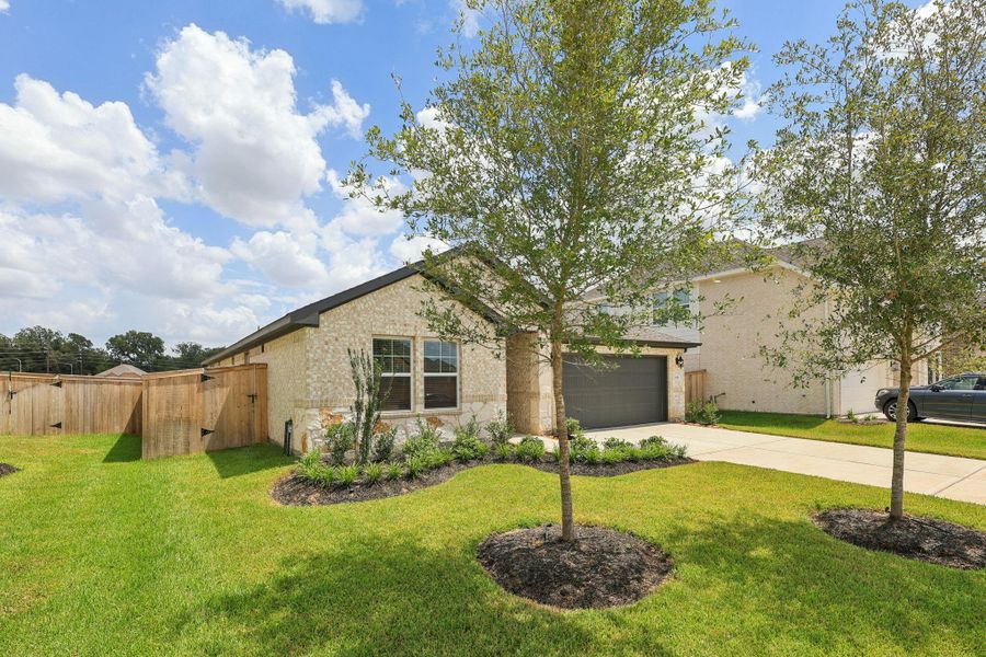 Front exterior of a new home in Kingdom Heights, Rosenberg, TX, highlighting curb appeal (Image 26). Front exterior of a new home in Kingdom Heights, Rosenberg, TX, highlighting curb appeal (Image 26).