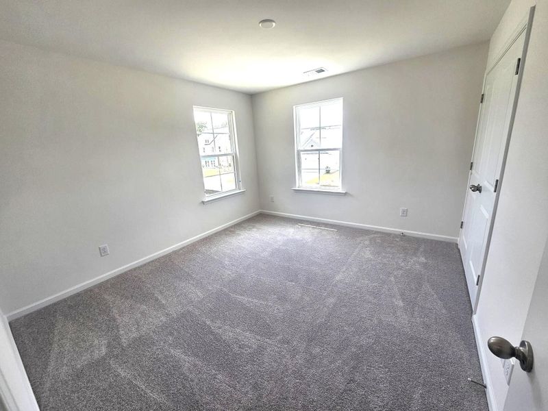 Spacious, unfurnished interior of a new home in Creekside at Andrews, Summerville (Image 11).