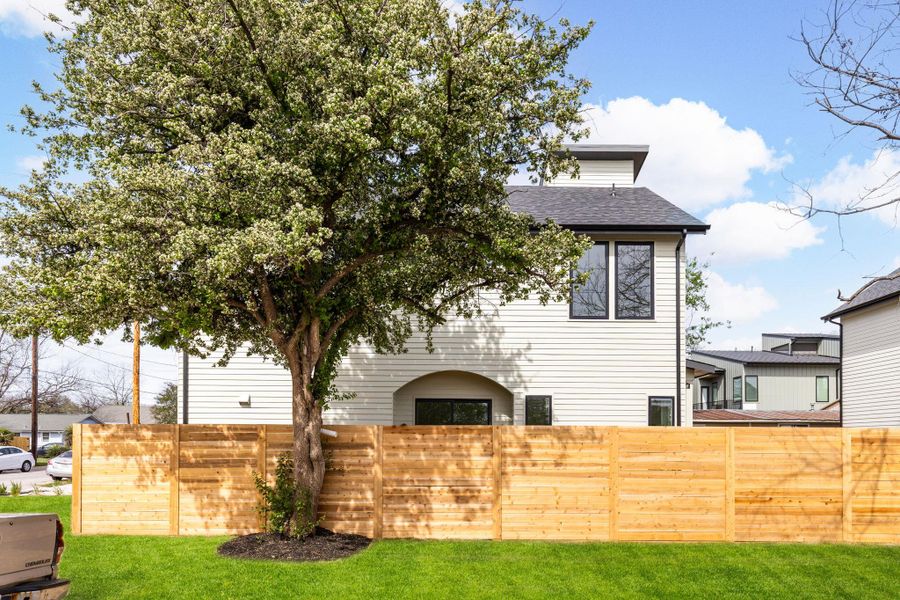 Back of house with a shingled roof Back of house with a shingled roof