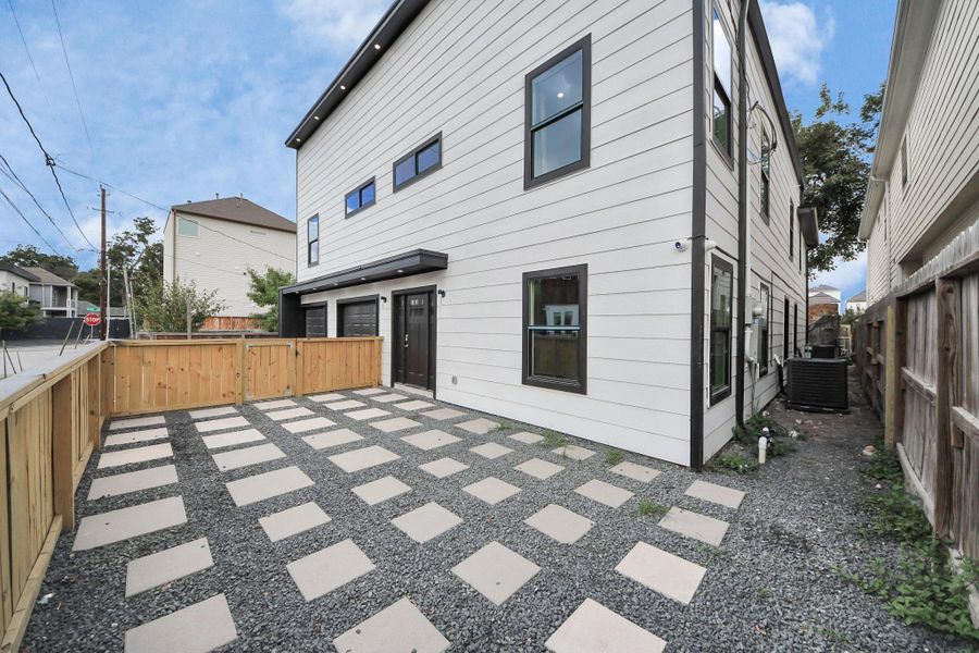 Privately fenced courtyard with crushed granite and concrete pavers, offering a low-maintenance outdoor space. Ideal for relaxing or entertaining. Privately fenced courtyard with crushed granite and concrete pavers, offering a low-maintenance outdoor space. Ideal for relaxing or entertaining.