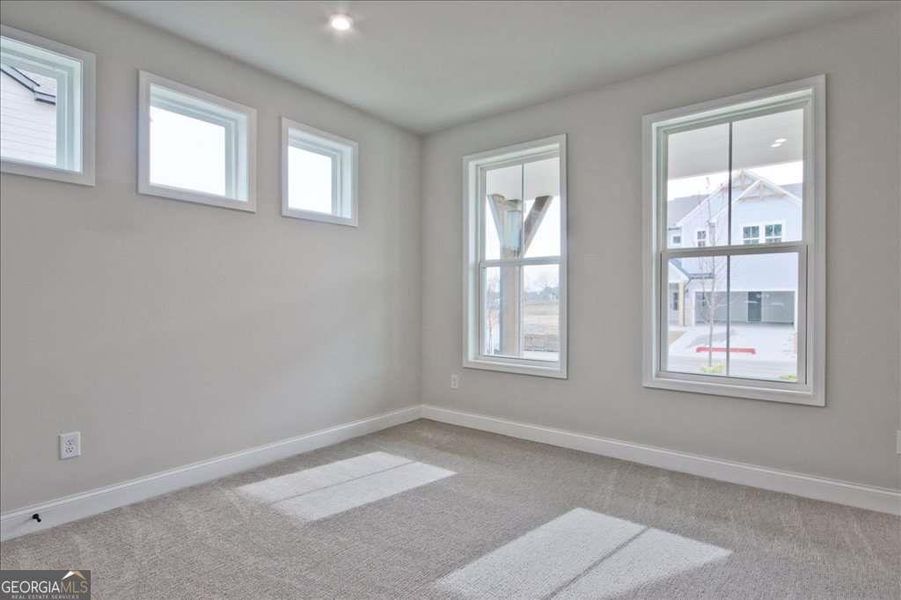 Spacious, unfurnished interior of a new home in The Paddocks at Doc Hughes, Buford (Image 43).