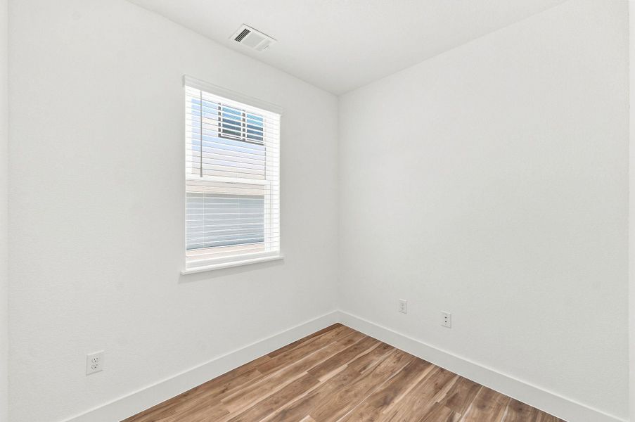 Private dedicated office with natural light and wood-look flooring, providing a comfortable, functional space for working or studying from home. Private dedicated office with natural light and wood-look flooring, providing a comfortable, functional space for working or studying from home.
