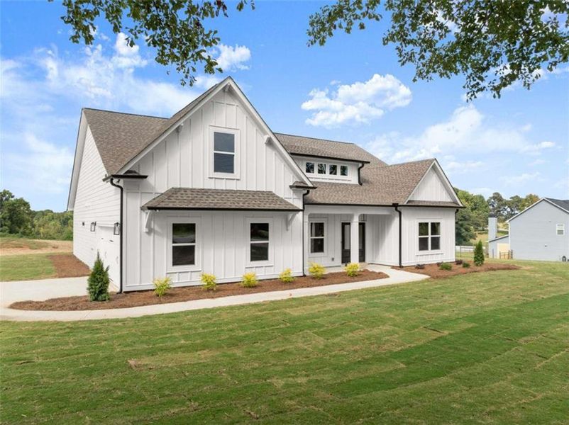 Front exterior of a new home in , Maysville, GA, highlighting curb appeal (Image 1). Front exterior of a new home in , Maysville, GA, highlighting curb appeal (Image 1).