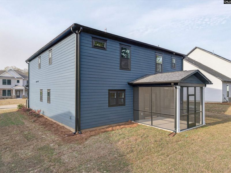 Exterior details and patio area of a home in Collins Cove, Chapin (Image 34).