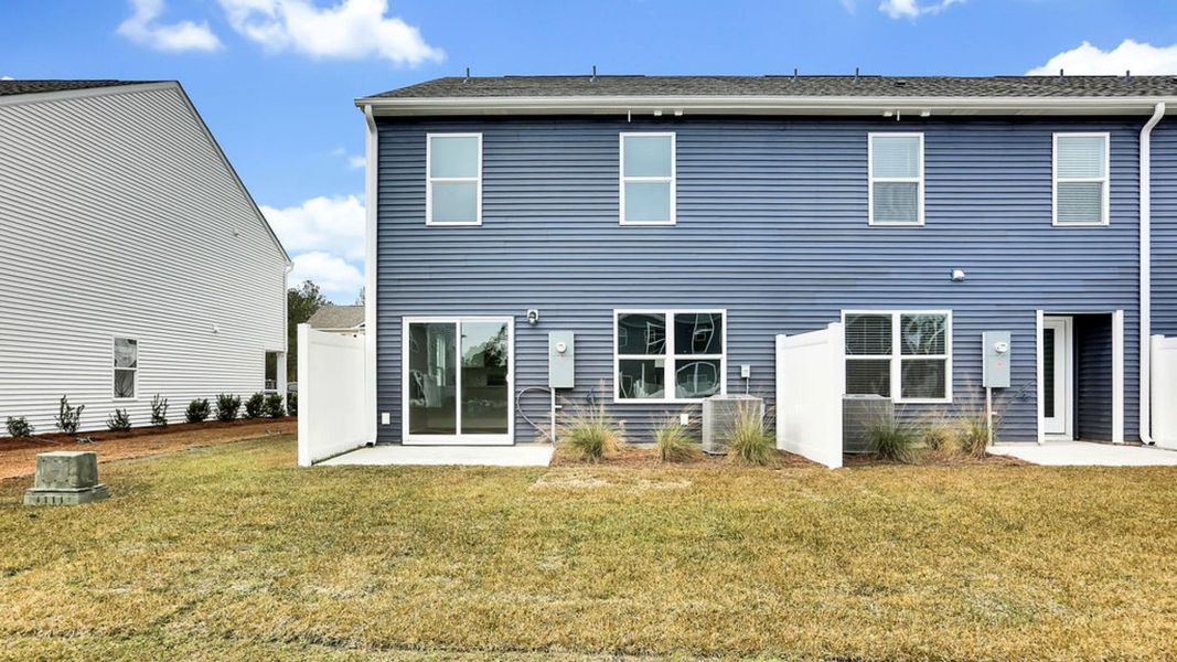 Exterior details and patio area of a home in Grayson Park Townhomes, Leland (Image 4).