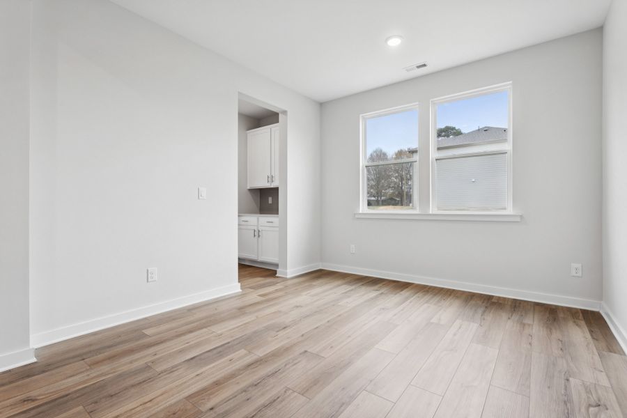 A room with a wood floor and a wood floor. A room with a wood floor and a wood floor.
