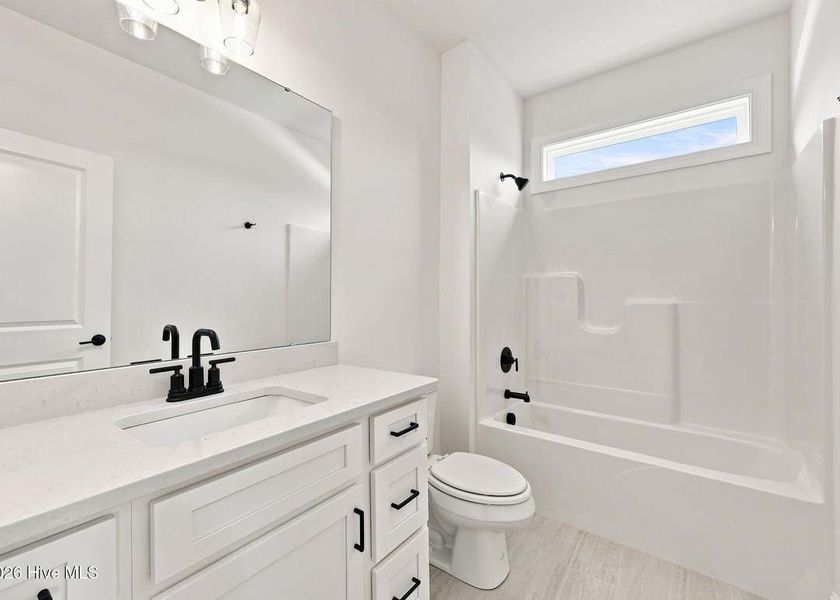 Furnished interior view inside a new home in Dixon Grove, Grimesland (Image 11).