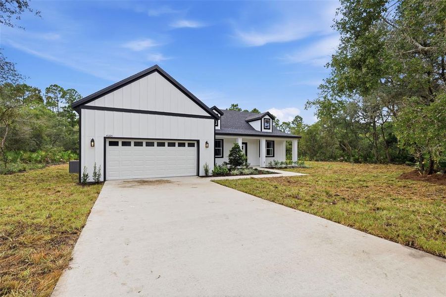 Front exterior of a new home in , Eustis, FL, highlighting curb appeal (Image 23).