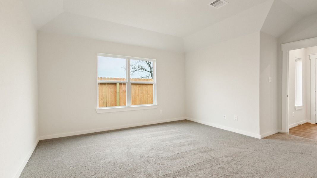 Representative furnished interior of a home built from the Driskill by Brightland Homes in Sunterra, Katy (Image 9).