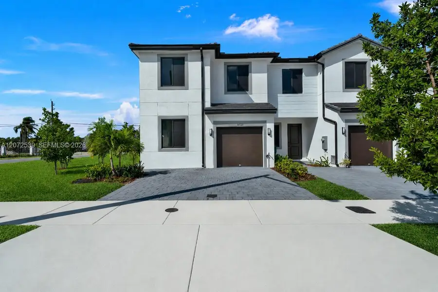 Front exterior of a new home in , Homestead, FL, highlighting curb appeal (Image 20).