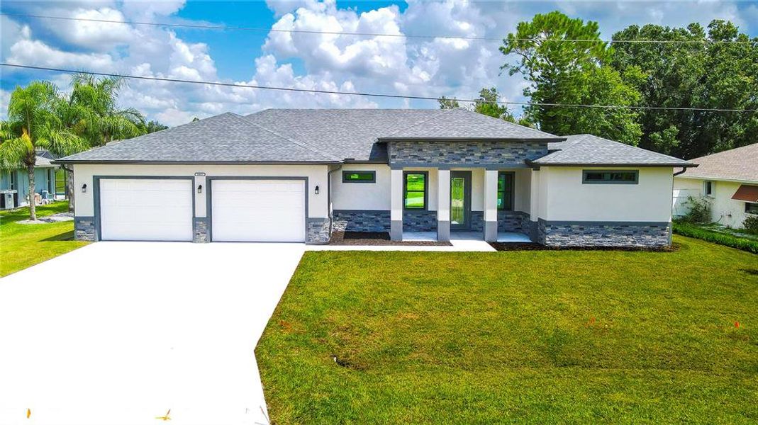 Front exterior of a new home in , Punta Gorda, FL, highlighting curb appeal (Image 1). Front exterior of a new home in , Punta Gorda, FL, highlighting curb appeal (Image 1).