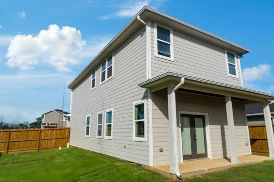 Rear view of house featuring french doors