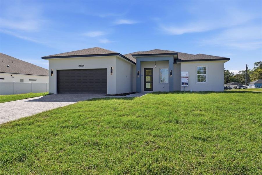 Front exterior of a new home in , Ocala, FL, highlighting curb appeal (Image 18).
