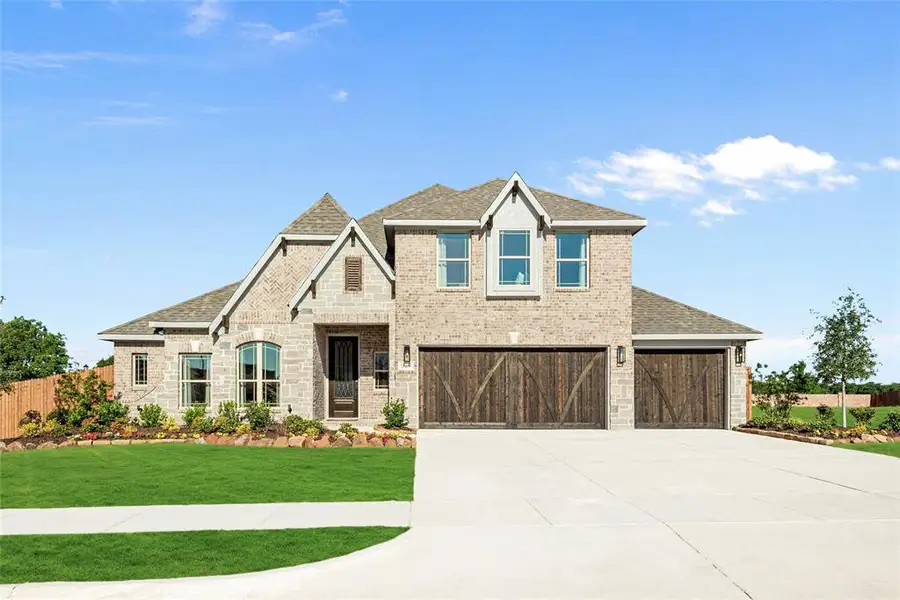 Front exterior of a new home in Trees Farm, DeSoto, TX, highlighting curb appeal (Image 2).