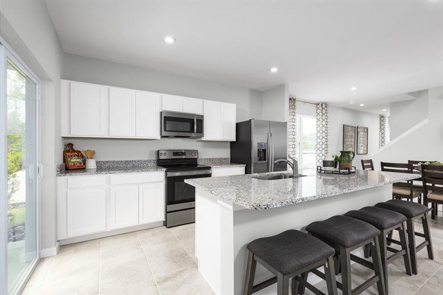 Representative furnished interior of a home built from the Neptune End Home by Ryan Homes in Waverly at Wylder, Port St. Lucie (Image 3).