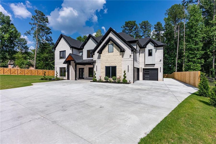 Front exterior of a new home in , Lawrenceville, GA, highlighting curb appeal (Image 47). Front exterior of a new home in , Lawrenceville, GA, highlighting curb appeal (Image 47).