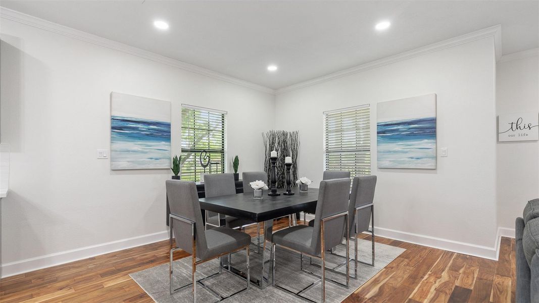 Bright dining area with front yard views.