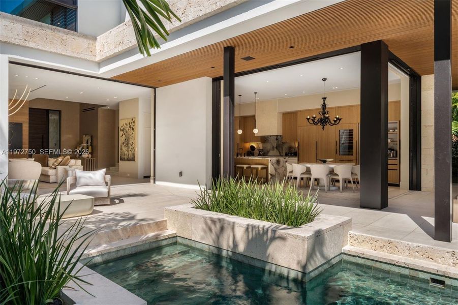 Exterior details and patio area of a home in , Miami Beach (Image 3). Exterior details and patio area of a home in , Miami Beach (Image 3).