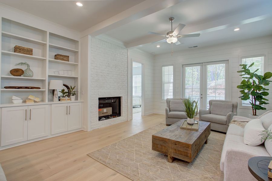 The family room features a brick fireplace