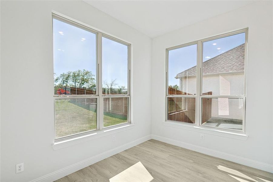 Unfurnished room with light wood-type flooring