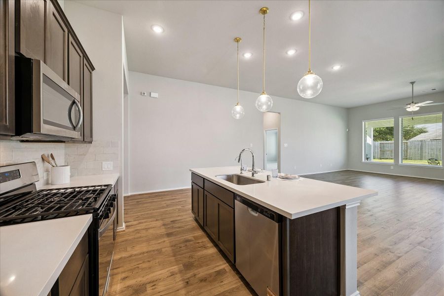 One last look at the kitchen as well as the living areas of this stunning open concept home.