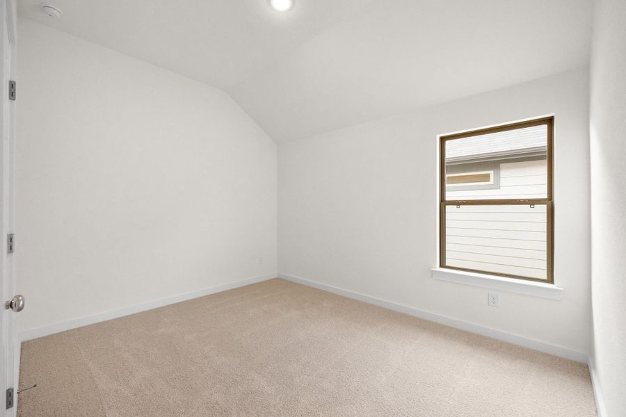 Bedroom in the Turquoise home plan by Trophy Signature Homes – REPRESENTATIVE PHOTO