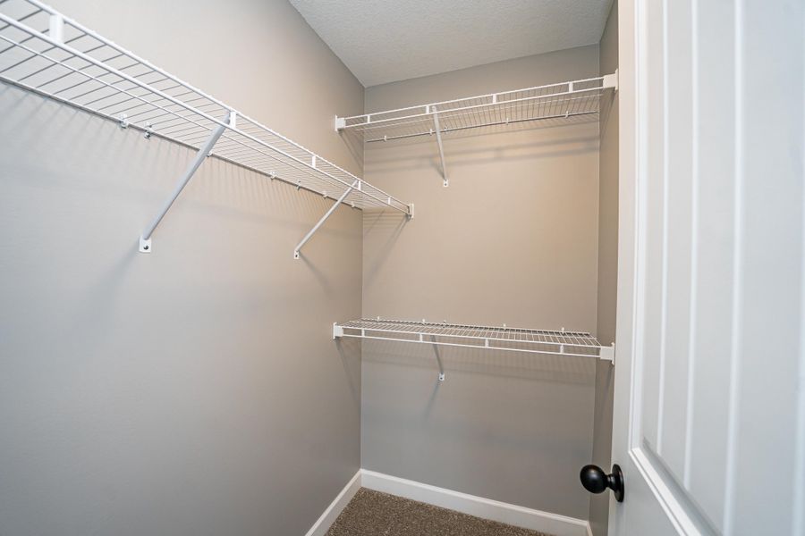Representative unfurnished interior of a home built from the Saxon by Enchanted Homes in Guadalupe Heights, Seguin (Image 38).