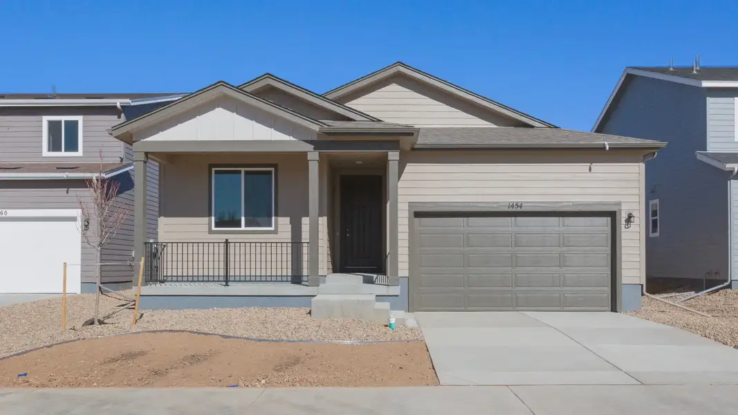 Front exterior of a new home in Trevenna, Windsor, CO, highlighting curb appeal (Image 1). Front exterior of a new home in Trevenna, Windsor, CO, highlighting curb appeal (Image 1).