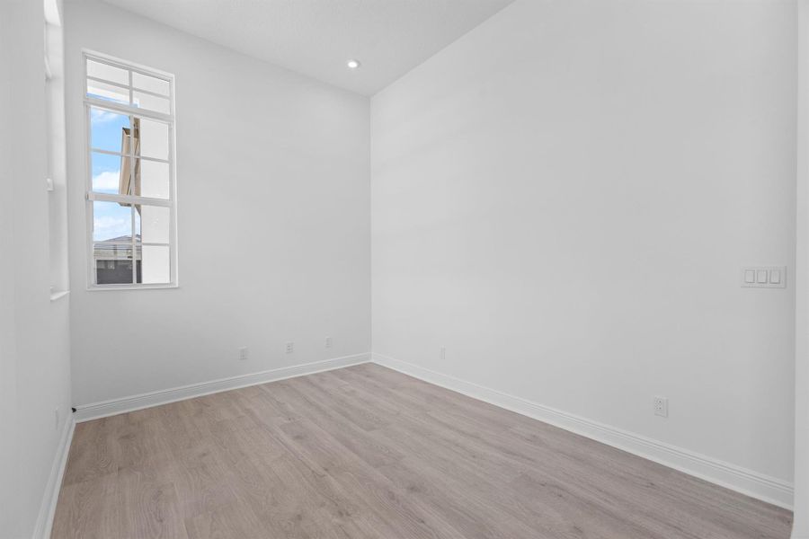 Furnished interior view inside a new home in PGA Village Verano, Port St. Lucie (Image 14).