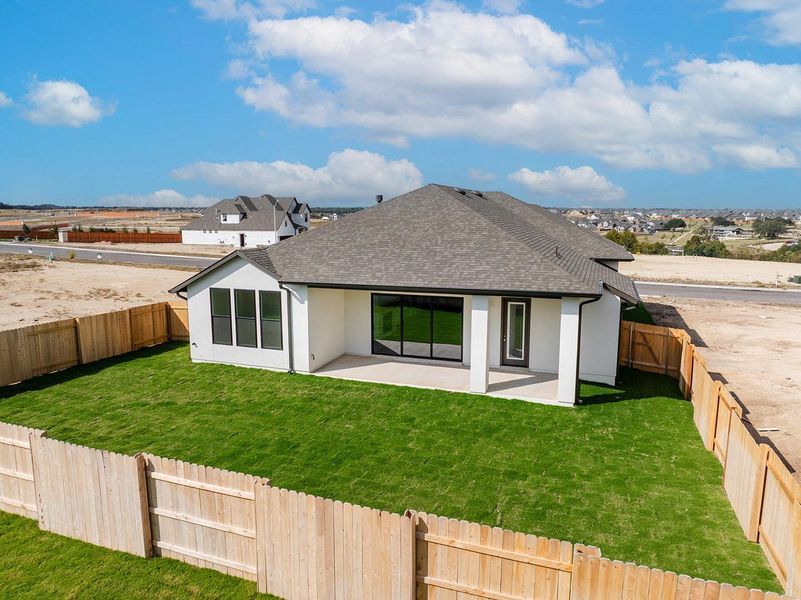 Exterior details and patio area of a home in Lariat - 70', Liberty Hill (Image 3).