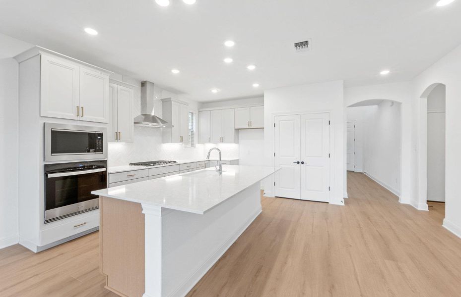 Furnished interior view inside a new home in West Cypress Hills, Spicewood (Image 6).