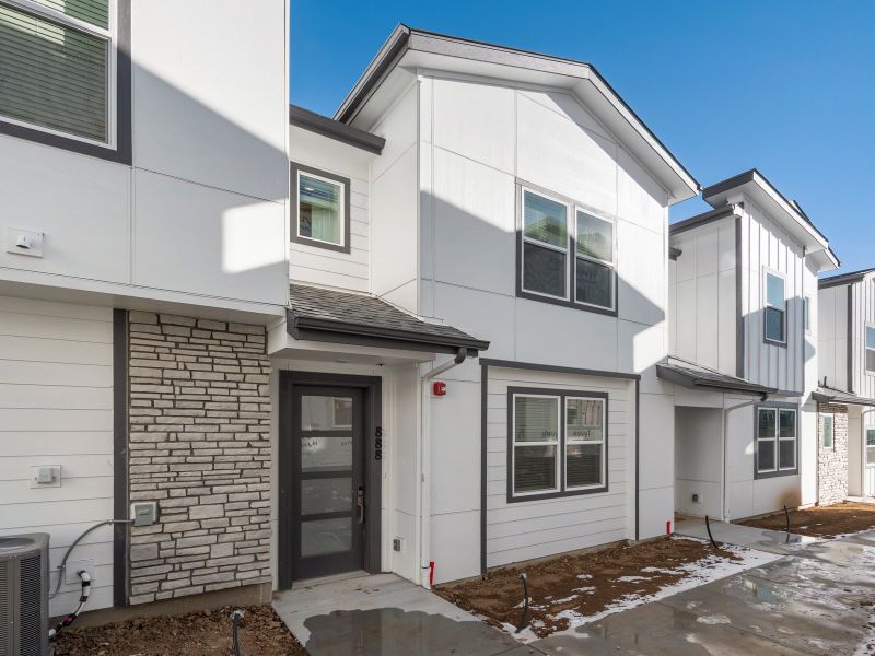 Front exterior of a new home in The Vistas at West Mesa, Colorado Springs, CO, highlighting curb appeal (Image 1).