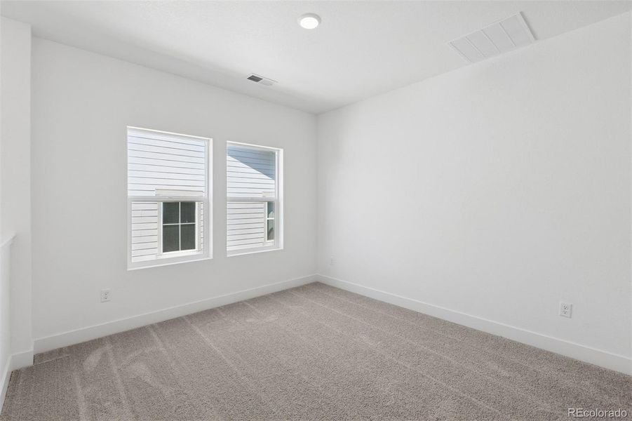 Spacious, unfurnished interior of a new home in Painted Prairie Cottage, Aurora (Image 22).