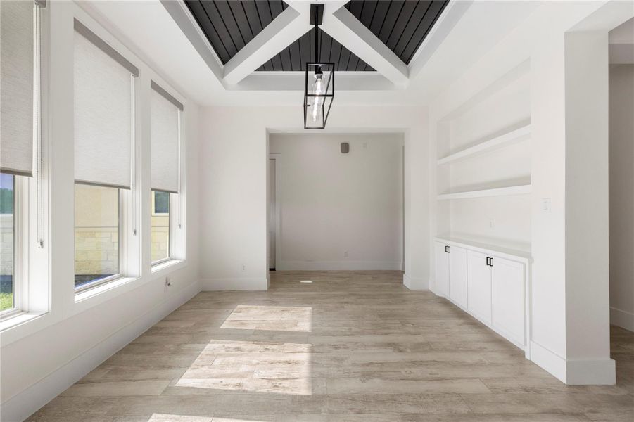 To the left of the main entry, you will find this incredible dining area. Shelves and cabinets make it easy for entertaining. To the left of the main entry, you will find this incredible dining area. Shelves and cabinets make it easy for entertaining.