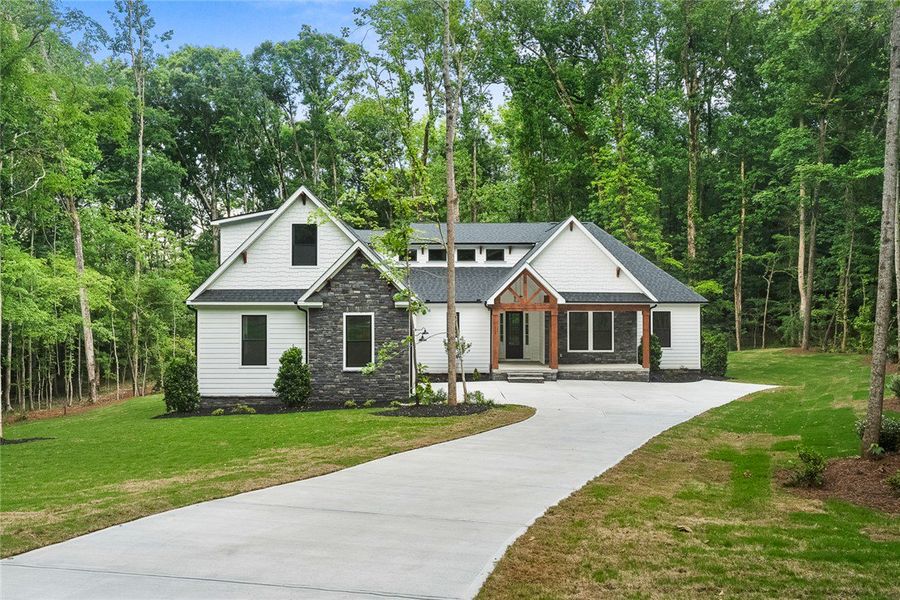A graceful driveway leads to a modern home embrace A graceful driveway leads to a modern home embrace