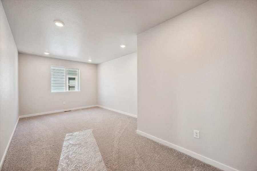 A room with a rug and a rug. A room with a rug and a rug.