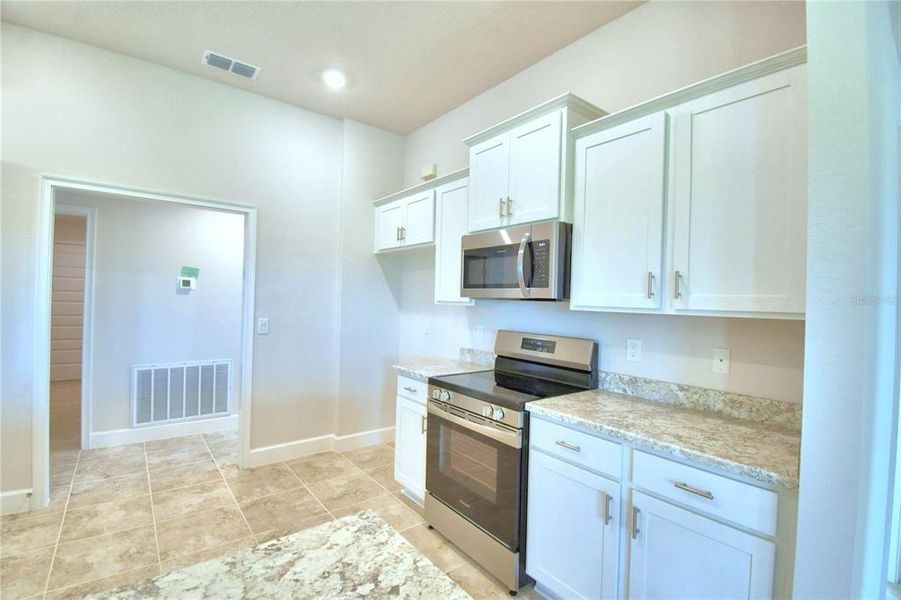 Furnished interior view inside a new home in Cadence Crossing, Auburndale (Image 6).