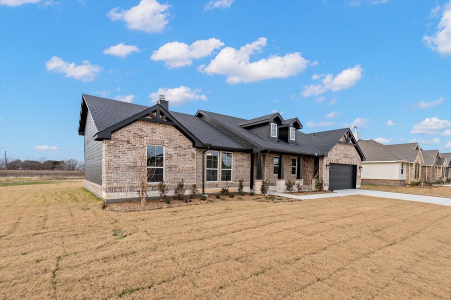 Front exterior of a new home in Fairview Meadows, New Fairview, TX, highlighting curb appeal (Image 27).