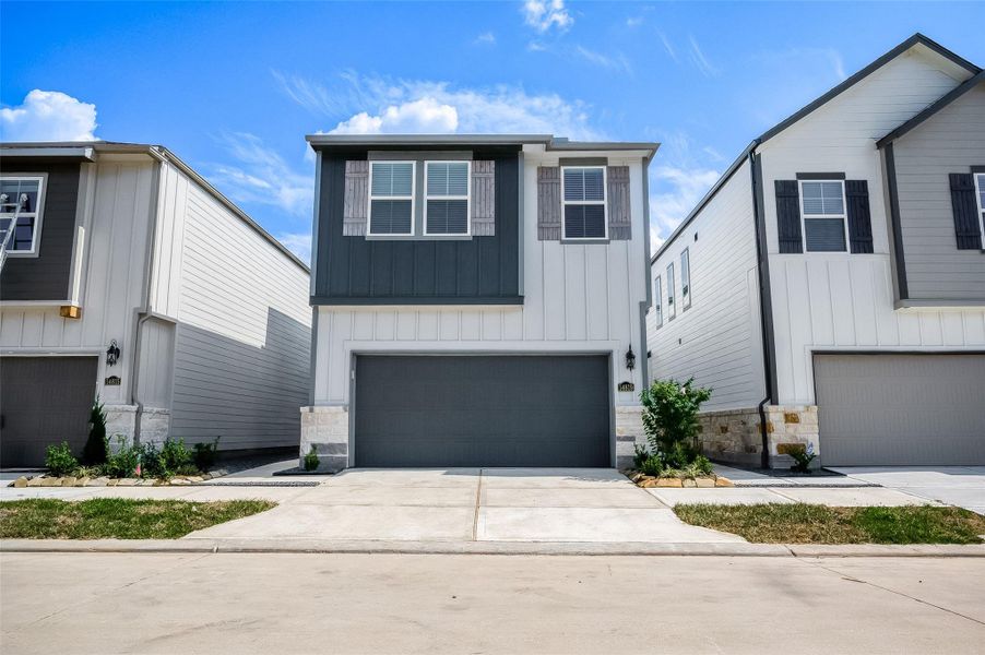 Front exterior of a new home in McClendon Park Village, Houston, TX, highlighting curb appeal (Image 23). Front exterior of a new home in McClendon Park Village, Houston, TX, highlighting curb appeal (Image 23).