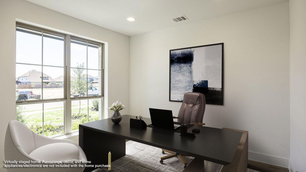 Home office with a residential view and recessed lighting Home office with a residential view and recessed lighting