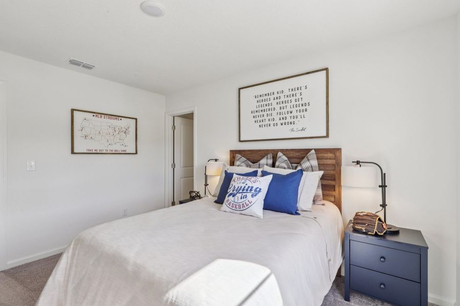 A bed with blue pillows. A bed with blue pillows.