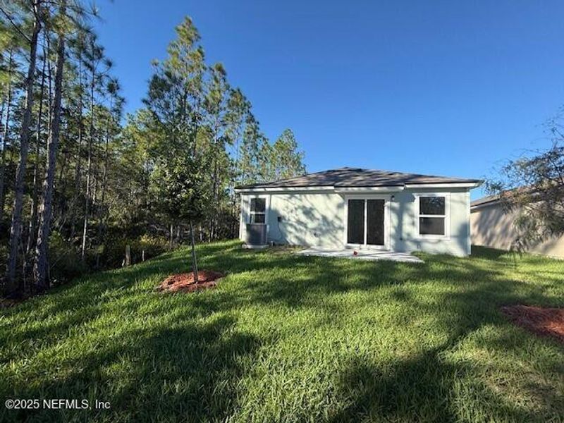 Exterior details and patio area of a home in Grand Reserve, Bunnell (Image 3).