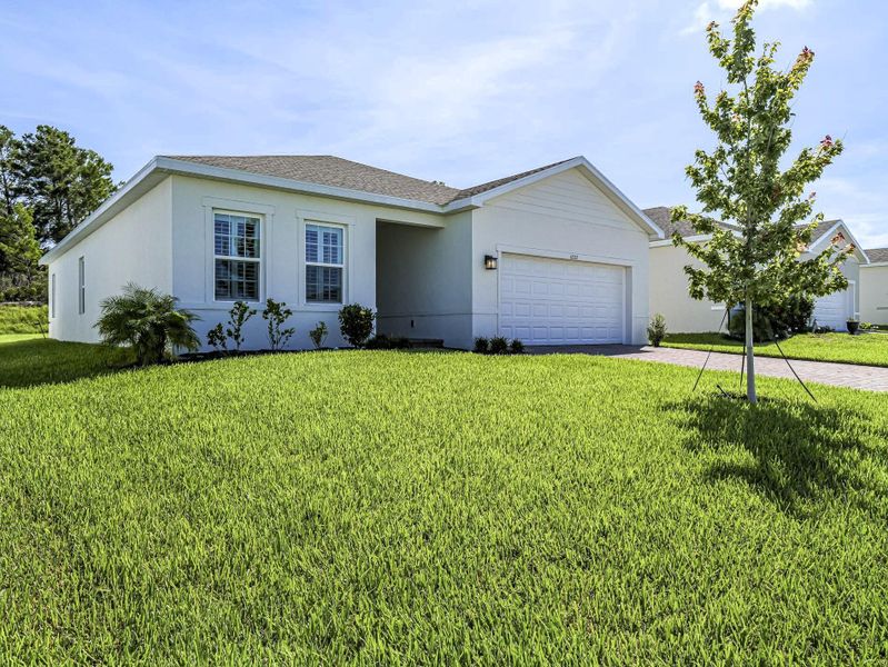 Front exterior of a new home in , Vero Beach, FL, highlighting curb appeal (Image 2).