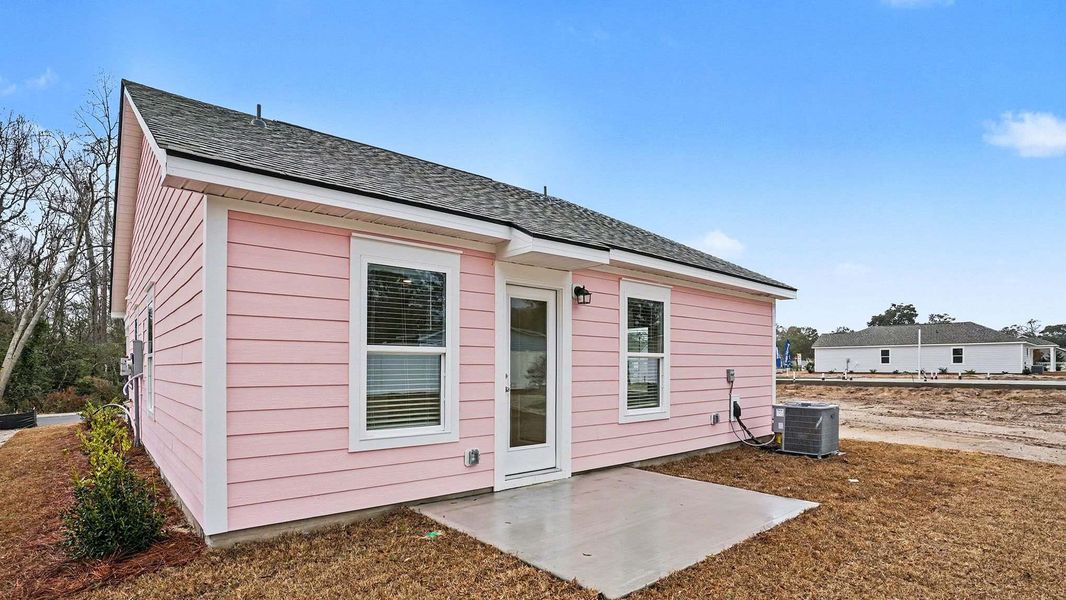 Exterior details and patio area of a home in Southshore Bay, Sunset Beach (Image 4).