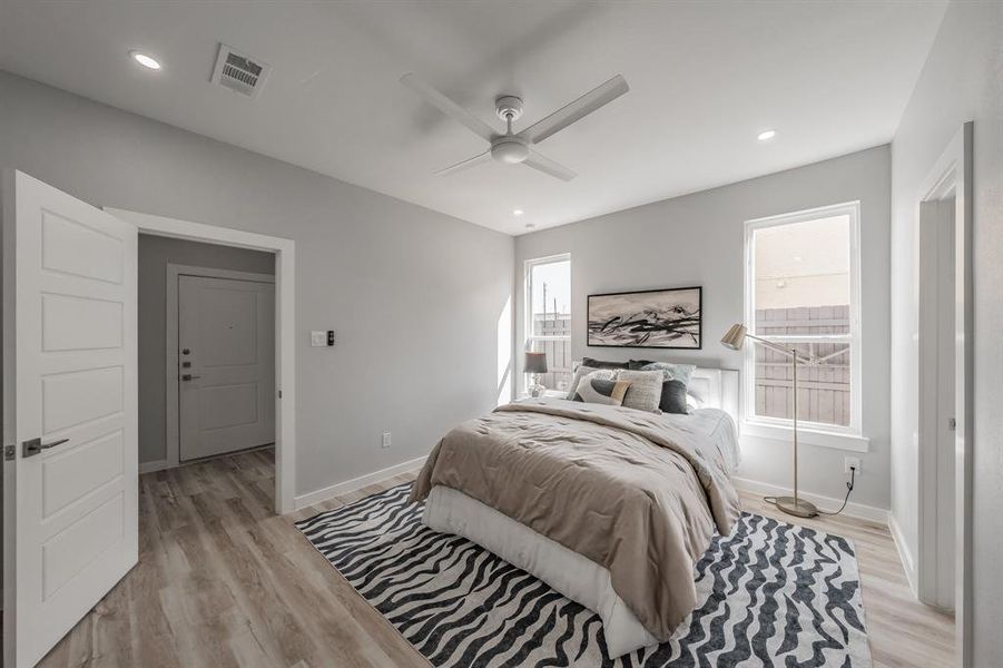 Bedroom featuring ceiling fan and light hardwood / wood-style floors