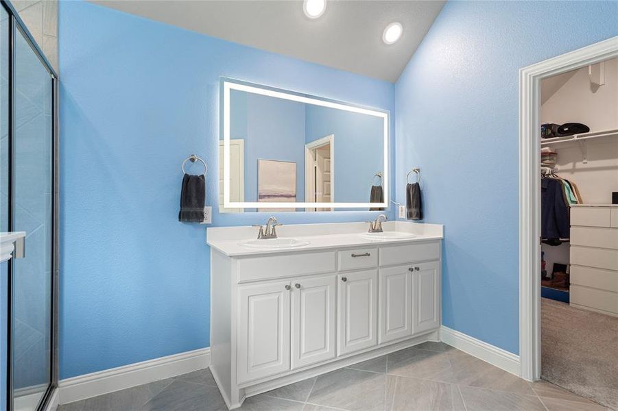 Primary bath with anti-fog, cosmetic mirror.