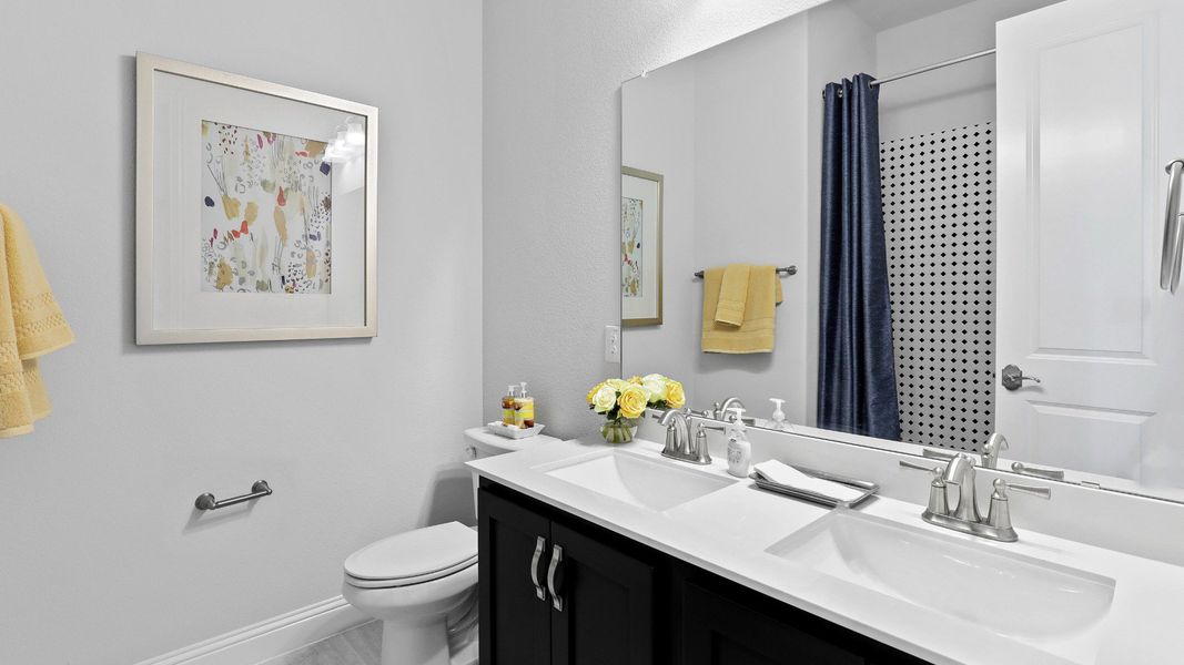 Representative furnished interior of a home built from the Laurel by Brightland Homes in Sunterra, Katy (Image 13).