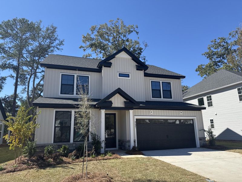 Front exterior of a new home in , North Charleston, SC, highlighting curb appeal (Image 24). Front exterior of a new home in , North Charleston, SC, highlighting curb appeal (Image 24).